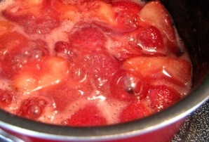strawberries and sugar in sauce pan
