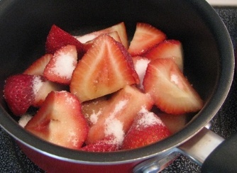 strawberry slices and sugar for sauce