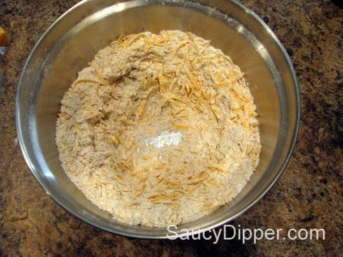 Mix the cheese and dry ingredients thoroughly before dumping in beer Mix grated cheese dry ingredients